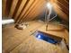 Spacious attic with exposed wooden beams and plywood subflooring ready for your finishing ideas at 12231 Valley View Cir, Indianapolis, IN 46229