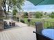 Enjoy the backyard lake view from this expansive back deck with an outdoor seating area and gas fireplace at 12231 Valley View Cir, Indianapolis, IN 46229