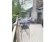 Spacious back deck features outdoor seating and dining area with a gas fireplace, perfect for entertaining at 12231 Valley View Cir, Indianapolis, IN 46229