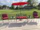 Outdoor seating provides a place to relax on the lawn and enjoy the beautiful green backyard at 12231 Valley View Cir, Indianapolis, IN 46229