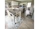 Bright kitchen featuring stainless steel appliances, tiled floors, and an open layout at 12231 Valley View Cir, Indianapolis, IN 46229