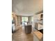 Spacious kitchen with stainless appliances, a center island, and a view of the backyard at 12231 Valley View Cir, Indianapolis, IN 46229