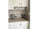 Bright kitchen corner with Keurig station and white cabinets, perfect for morning coffee at 12231 Valley View Cir, Indianapolis, IN 46229