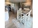 Well-lit kitchen with stainless steel appliances, island, and an adjacent dining area at 12231 Valley View Cir, Indianapolis, IN 46229