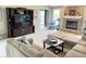 Comfortable living room with plush seating, fireplace, and backyard access at 12231 Valley View Cir, Indianapolis, IN 46229
