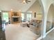 Cozy living room with a brick fireplace, vaulted ceilings, and ample natural light at 12231 Valley View Cir, Indianapolis, IN 46229
