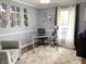Bright office space with modern desk, decorative rug, and a comfortable chair, ideal for productivity at 12231 Valley View Cir, Indianapolis, IN 46229
