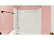 Clean pink bathroom featuring a shower/tub combination with a white shower curtain and updated fixtures at 1234 Breaside Cir, Greenwood, IN 46143