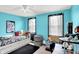 Bright bedroom with teal walls, neutral carpet, and windows at 1234 Breaside Cir, Greenwood, IN 46143