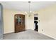 Dining room with a wooden china cabinet, chandelier, and neutral walls and carpeting at 1234 Breaside Cir, Greenwood, IN 46143