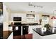 Bright kitchen boasts white cabinets, black appliances and a center island at 1234 Breaside Cir, Greenwood, IN 46143