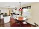 Eat-in kitchen with white cabinetry, black appliances and a decorative light fixture at 1234 Breaside Cir, Greenwood, IN 46143