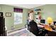 Cozy home office featuring light green walls, a computer desk, and ample shelving for storage and organization at 1234 Breaside Cir, Greenwood, IN 46143