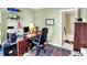 A tidy office space with a desk, shelves, and a view into another room, perfect for working from home at 1234 Breaside Cir, Greenwood, IN 46143