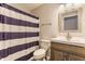 The bathroom includes modern fixtures, a striped shower curtain, and a wood-look vanity at 12444 Bearsdale Dr, Indianapolis, IN 46235