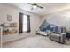 Charming bedroom with mountain-themed mural, recliner, and toy shelves at 12444 Bearsdale Dr, Indianapolis, IN 46235
