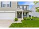 Attractive home with a cozy porch area, a well-kept lawn and a two-car garage at 12444 Bearsdale Dr, Indianapolis, IN 46235