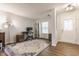 Comfortable home office featuring a desk, chair, shelving, and a bright window for natural light at 12444 Bearsdale Dr, Indianapolis, IN 46235