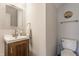 Cozy powder room features stylish vanity with modern fixtures and neutral decor at 12444 Bearsdale Dr, Indianapolis, IN 46235