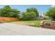 The backyard features a manicured lawn with flower beds and wood fencing at 12496 Wolf Run Rd, Noblesville, IN 46060