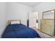 Bedroom features a single bed, neutral carpet, a dresser, and a ceiling fan at 12496 Wolf Run Rd, Noblesville, IN 46060