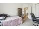 Bedroom features a single bed, neutral carpet, a closet, and a side table at 12496 Wolf Run Rd, Noblesville, IN 46060