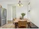 Cozy dining area adjacent to the kitchen, featuring a wooden table set for a meal and great natural light at 12496 Wolf Run Rd, Noblesville, IN 46060