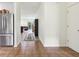 Open hallway leading to a bright living space, featuring tile flooring and a view of the open-concept design at 12496 Wolf Run Rd, Noblesville, IN 46060