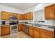 Modern kitchen featuring stainless steel appliances, plenty of cabinet space, and a functional design at 12496 Wolf Run Rd, Noblesville, IN 46060