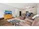 Spacious living room featuring comfortable seating, wood-look floors, and plenty of natural light at 12496 Wolf Run Rd, Noblesville, IN 46060