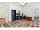 Functional office space with a ceiling fan, desk setup, and modern flooring perfect for a home office at 12496 Wolf Run Rd, Noblesville, IN 46060