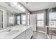 Modern bathroom with large mirror, dual sinks and a glass shower enclosure at 13050 Grand Vue Dr, Carmel, IN 46032