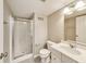 Bathroom showcases a glass door shower, toilet, vanity with sink, and large mirror at 13050 Grand Vue Dr, Carmel, IN 46032