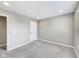 Neutral bedroom features soft carpet, recessed lighting, and a white door at 13050 Grand Vue Dr, Carmel, IN 46032