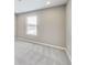 Bright bedroom features neutral walls, soft carpet, a window with blinds, and recessed lighting at 13050 Grand Vue Dr, Carmel, IN 46032