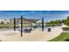 Community space has seating under shade, a walkway, and water fountains in the background at 13050 Grand Vue Dr, Carmel, IN 46032