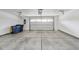 Clean and spacious garage with a roll-up door and ample room for storage at 13050 Grand Vue Dr, Carmel, IN 46032