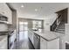 Beautiful kitchen with stainless steel appliances, island with sink, and access to balcony at 13050 Grand Vue Dr, Carmel, IN 46032