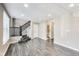 Living room features hardwood flooring, a staircase, and natural light from the windows at 13050 Grand Vue Dr, Carmel, IN 46032