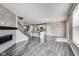 Bright living room showcasing an open floorplan, fireplace, and sliding door to balcony at 13050 Grand Vue Dr, Carmel, IN 46032