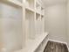 A mudroom features built-in storage solutions and shelving for organization at 13050 Grand Vue Dr, Carmel, IN 46032
