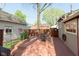 A backyard with a deck featuring outdoor seating and a vintage Coca-Cola sign on the detached garage at 1352 Clinton St, Noblesville, IN 46060