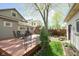 Backyard features a wooden deck with outdoor seating, perfect for relaxation and entertaining guests at 1352 Clinton St, Noblesville, IN 46060