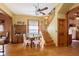 Bright dining room boasting hardwood floors, a classic wooden staircase, and traditional decor at 1352 Clinton St, Noblesville, IN 46060