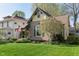 Charming vintage home with inviting covered porch, American flag, and blossoming tree at 1352 Clinton St, Noblesville, IN 46060