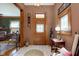 Cozy foyer featuring a classic wood door, neutral tiles, and vintage-inspired decor at 1352 Clinton St, Noblesville, IN 46060