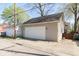 Side view of a detached two-car garage with a clean white door at 1352 Clinton St, Noblesville, IN 46060