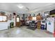 Spacious garage filled with vintage decor and a work area at 1352 Clinton St, Noblesville, IN 46060