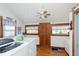 Bright laundry room with natural light, showcasing modern washer and dryer units, plus an exterior door at 1352 Clinton St, Noblesville, IN 46060