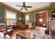 Comfortable living room showcasing hardwood floors, cozy seating, and vintage accents at 1352 Clinton St, Noblesville, IN 46060